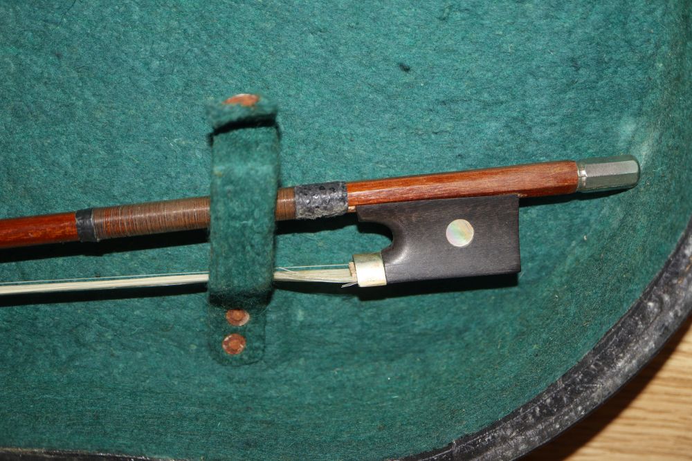 A 20th century Antonius Stradivarius Cremonensis violin, cased with two bows